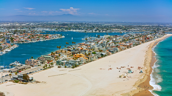 Aerial view of Newport beach with houses along coastline, Orange County, California, USA.