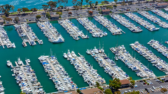 Aerial view of boats moored at marina amidst car park, Dana Point, Orange County, California, USA.