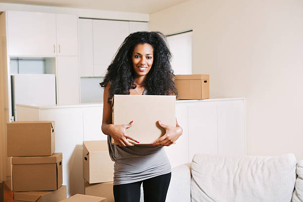 istock Young Woman Moving Home 164666707