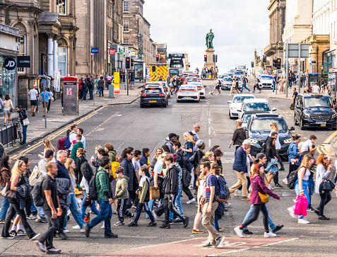 Edinburgh, Scotland - Cars waiting at the traffic lights as pedestrians cross Hanover Street in central Edinburgh.