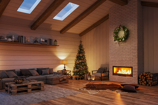 Cozy chalet living room with fireplace and Christmas decoration.
