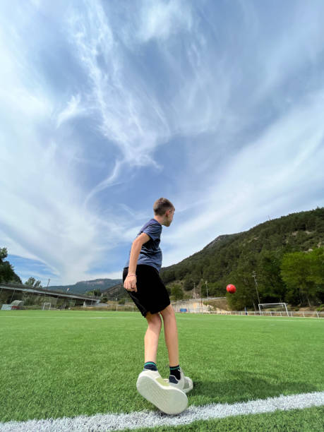 istock friends playing football 1646700136