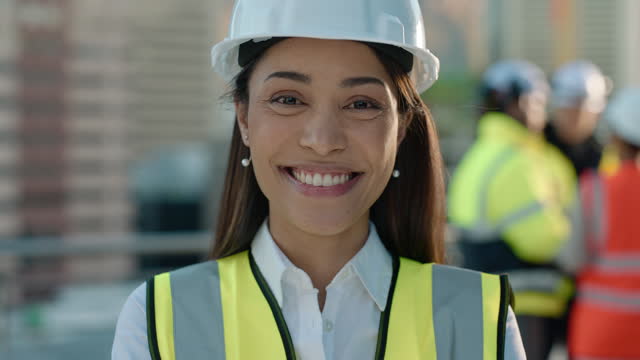 Engineering, smile and face of female industry worker on rooftop of building in the city. Happy, professional and young woman industrial foreman standing on balcony with pride for inspection in town.