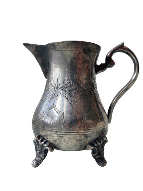 istock milk jug old antique silver ware isolated on white background 1646735857