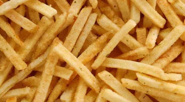 istock potato straws. potato background Macro. Falling potatoes, fries 1646739129