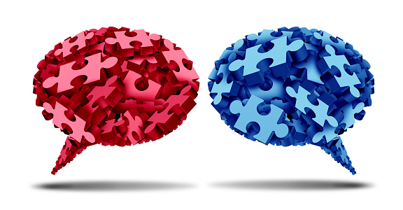 Communication Challenge as two opposing thought bubble shapes with jigsaw puzzle pieces representing tribal or tribalism in politics or political dispute as different ideology or ideas fighting for dominance as a 3D illustration.
