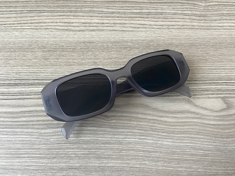 Sunglasses on the wood table with copy space