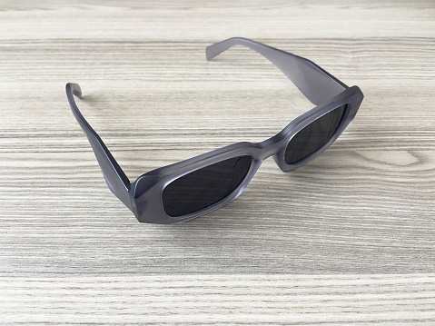 Sunglasses on the wood table with copy space