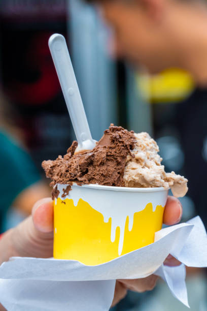istock woman  holds cardboard cup ice cream 1646773853