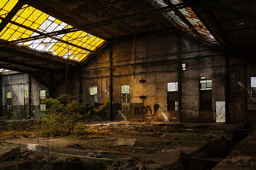 Poznan, Poland – May 19, 2023: A dilapidated, derelict, abandoned industrial building in the city of Poznan, Poland