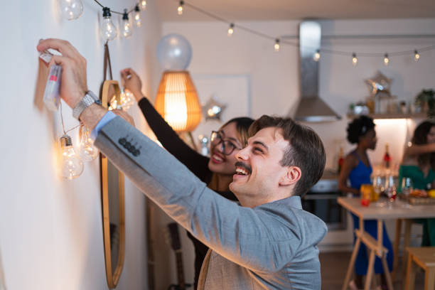 istock Multiracial people decorating house for the party 1646779883