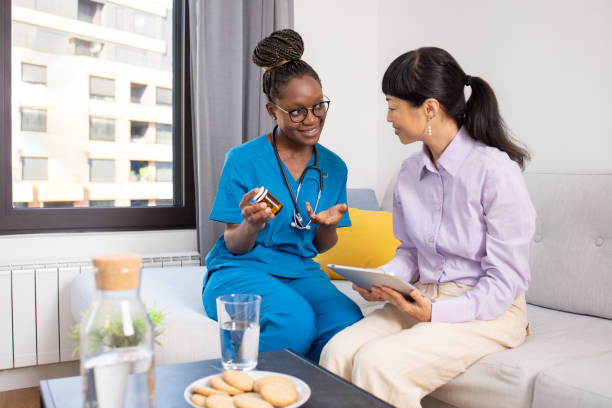 istock Nurse explains the medication to the patient 1646791142