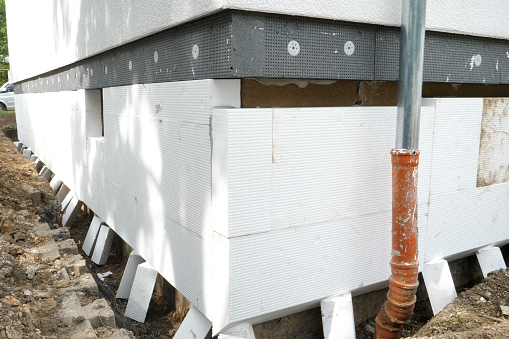 Construction site - insulation of a buildings facade and foundation