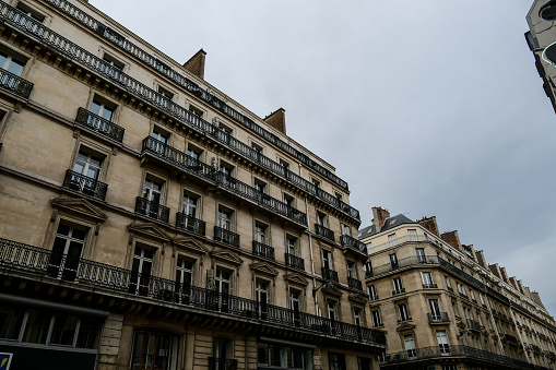 Paris, France - May 11, 2019:  Hotel Ritz on Place Vendome, Paris. Few people at the entrance around parked cars.