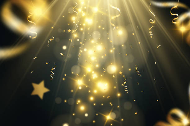 istock Golden confetti falls on a beautiful background. Falling streamers on stage. 1646846177
