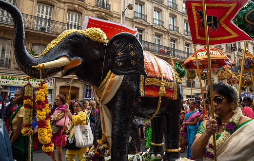 Paris, France - August 27, 2023: Street parade during festival of the god Ganesh. The Hindu and Tamil community celebrates the birthday of god-elephant Ganesh, Ganesh Chaturthi.