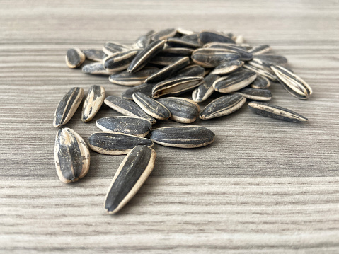 Close-up sunflower seeds on the wood background
