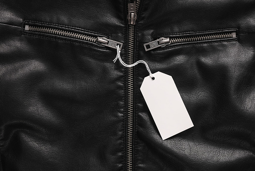 White blank price tag on black leather coat