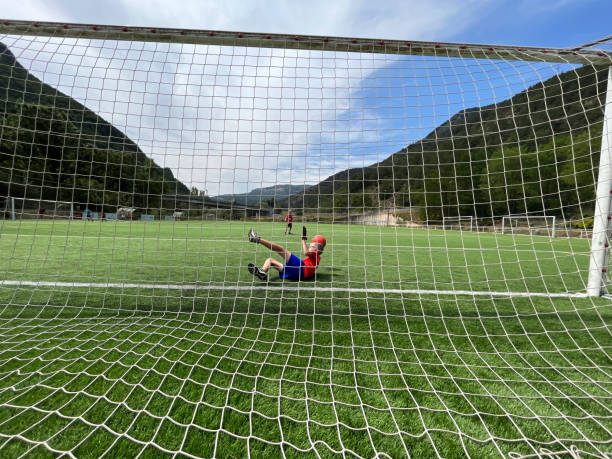 istock friends playing football 1646860635