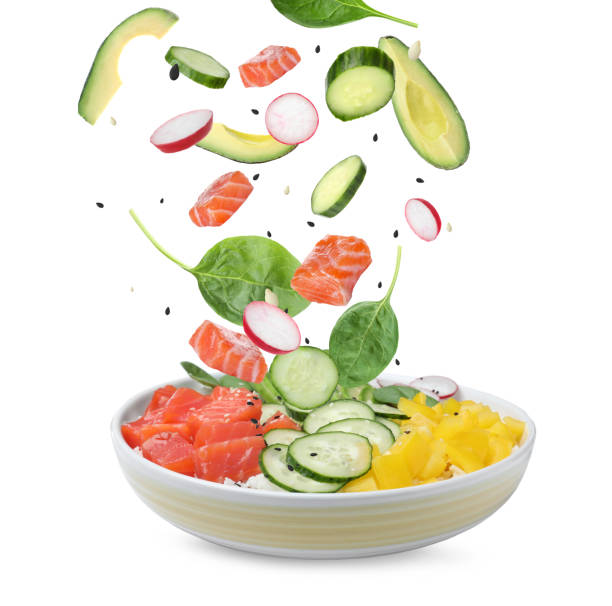 istock Poke recipe. Different ingredients falling into bowl on white background 1646863187