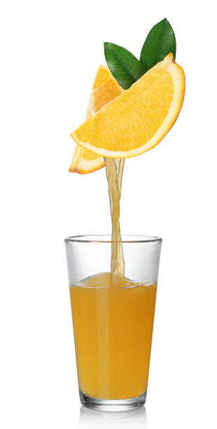 istock Pouring freshly squeezed juice from orange into glass on white background 1646864299