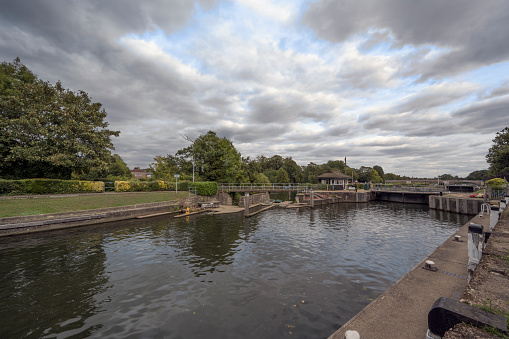 Riverside view towards Molesey Lock near Hampton Court Bridge near London England