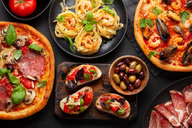 istock Italian cuisine. Pizza, pasta and toasts 1646868629