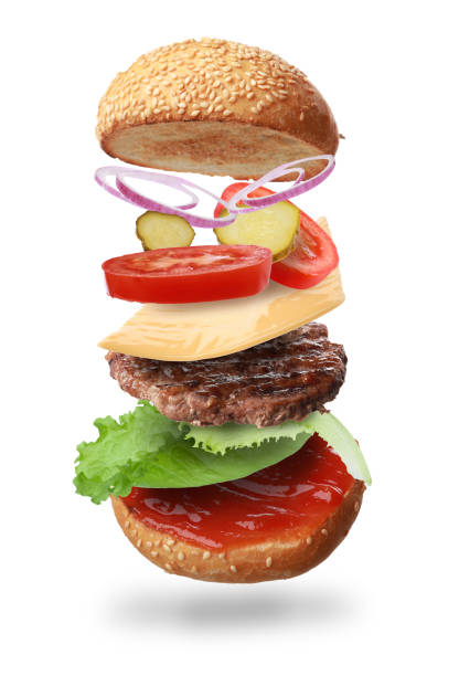 istock Delicious burger with different flying ingredients on white background 1646873672
