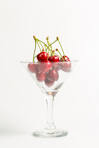 Ripe, red, sweet cherries on a white background