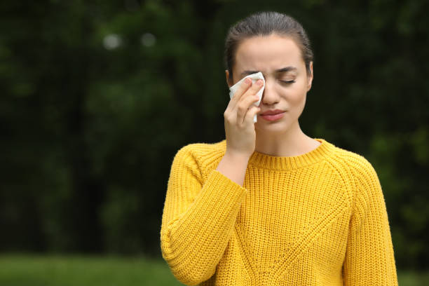 istock Woman suffering from seasonal spring allergy outdoors, space for text 1646961587