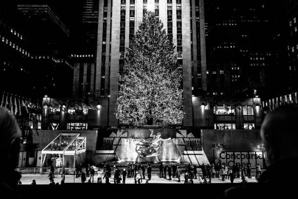 The Rockefeller Christmas Tree New York,NY USA- 2021 A view of the Rockefeller Christmas tree from The Rink at Rockefeller Center in New York City rockefeller ice rink stock pictures, royalty-free photos & images