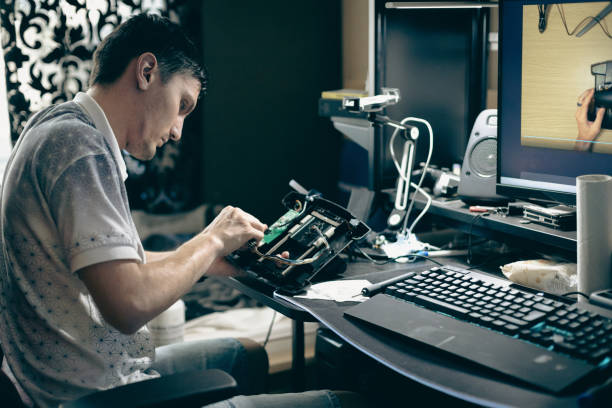 istock A young man repairs the engine steering wheel on a joystick. 1646964092