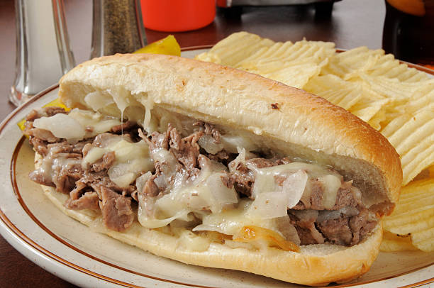 istock Philly cheese steak sandwich with side of potato chips 164696467