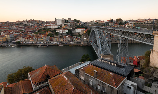 Cityscape of porto Portugal. Ponte de dom luis bridge at sunset. Douro river.