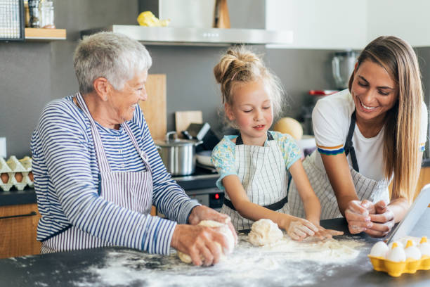 istock Three generation women making cookies and have fun 1647014402