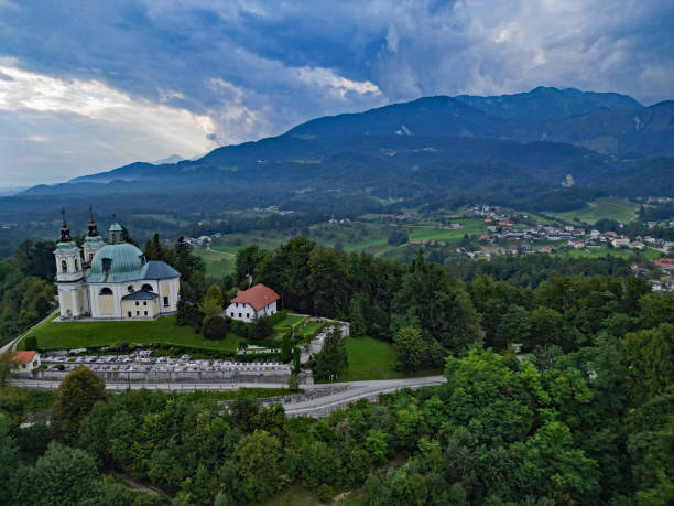 istock Church Cerkev sv. Ane Tunjice with dramatic clouds 1647015995