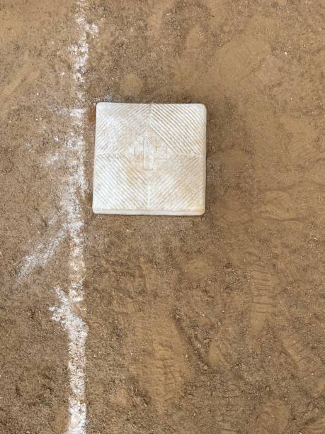 istock Baseball base and chalk line on a baseball field 1647018645
