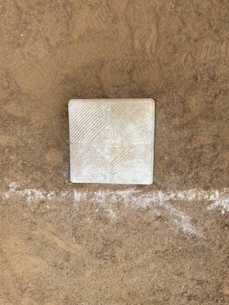 istock Baseball base and chalk line on a baseball field 1647018840