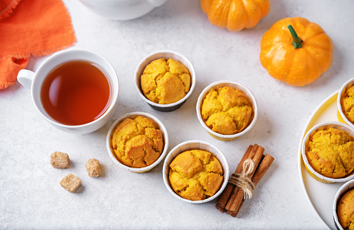 Pumpkin muffins with cup of tea. toning