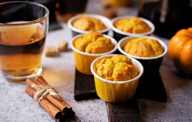 istock Pumpkin muffins with cup of tea 1647049343