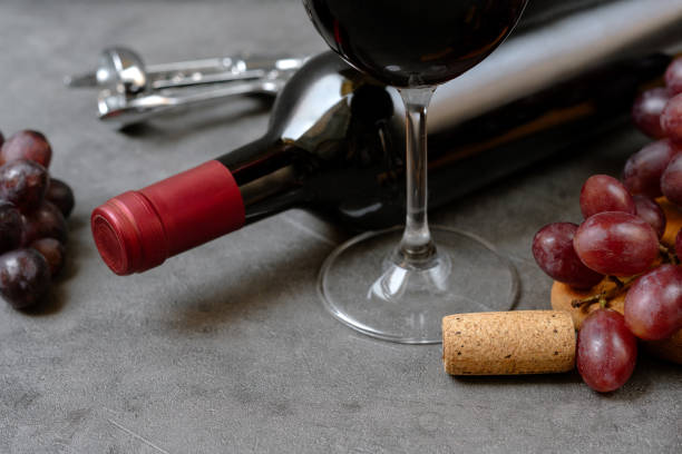 istock Glass of red wine and bottle and fresh crape 1647079023