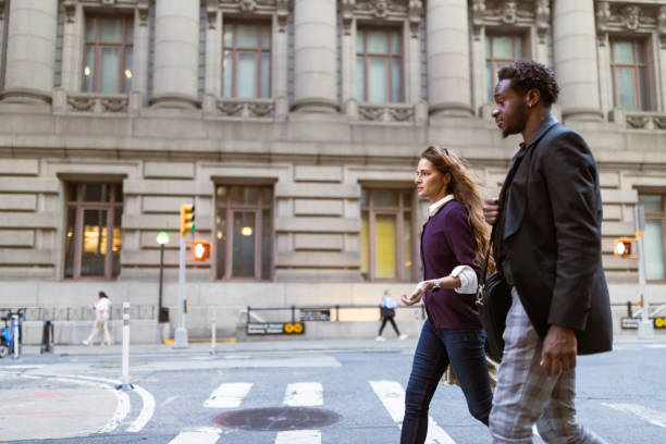 istock Colleagues rushing through Wall Street area 1647088604