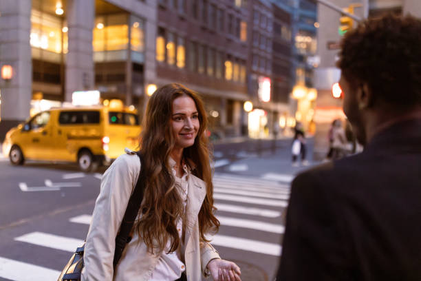 istock Colleagues rushing through Wall Street area 1647090220
