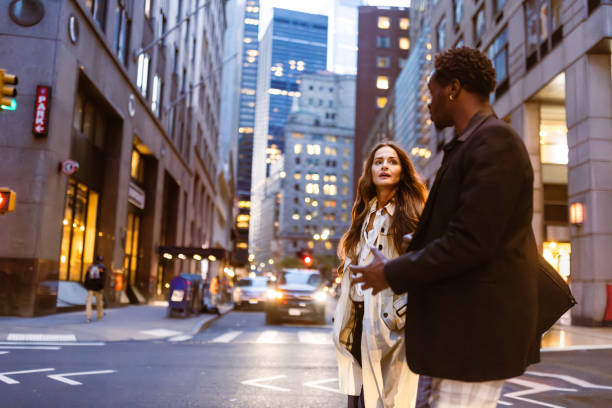 istock Colleagues rushing through Wall Street area 1647090754