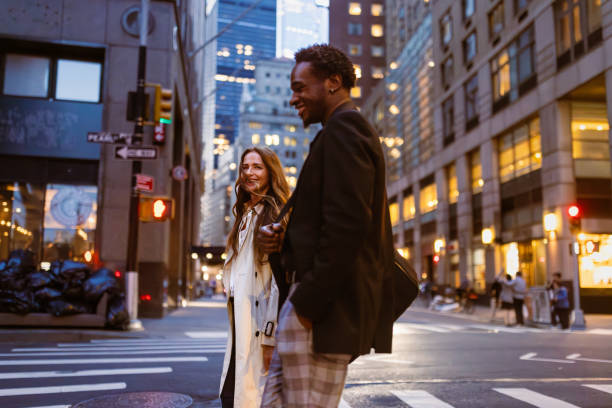 istock Colleagues rushing through Wall Street area 1647090774