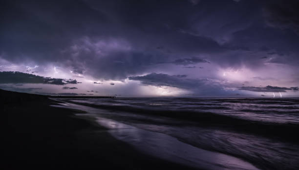 istock Severe thunderstorm and rain with many lightning peals and dense clouds, on the Black Sea coast in Georgia 1647093056