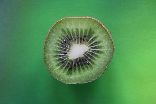 Stock photo showing a close-up view of healthy eating image of a half Chinese gooseberry (kiwi).