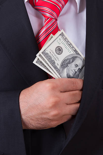 istock Man Putting Money into Pocket 164717219