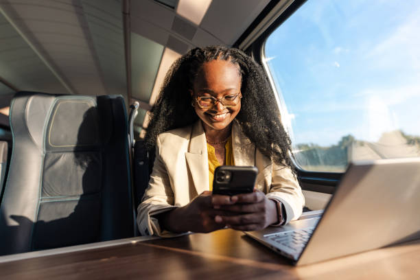 istock Business on the go. Young woman working during a train ride 1647176683