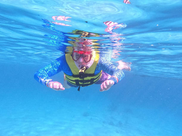 istock senior adult snorkeling 1647179741